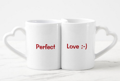 His and hers mugs, with the second one curved around the first, with the statements Perfect Love. The handles are in the shape of hearts