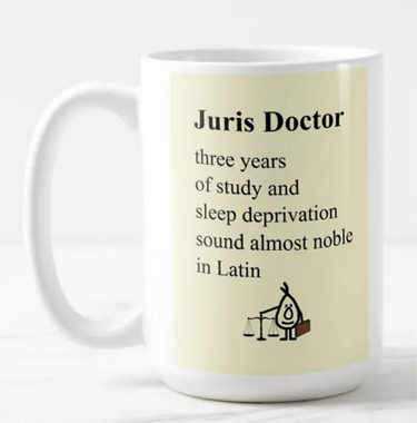Funny mug for a JD recipient. Reads, "Three years of study and sleep deprivation sound almost noble in Latin."